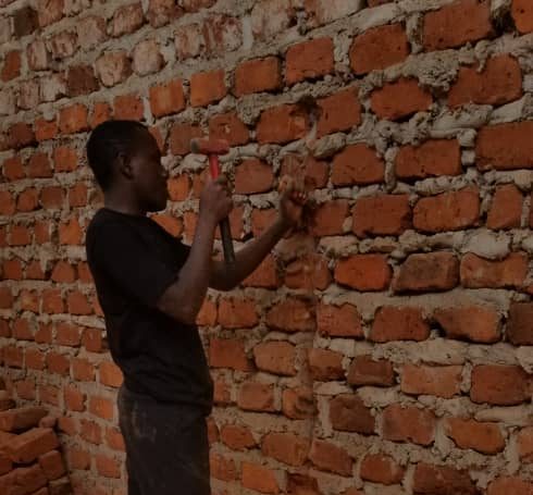 Our electrical student is currently chiseling the wall for conduit work or pipe work